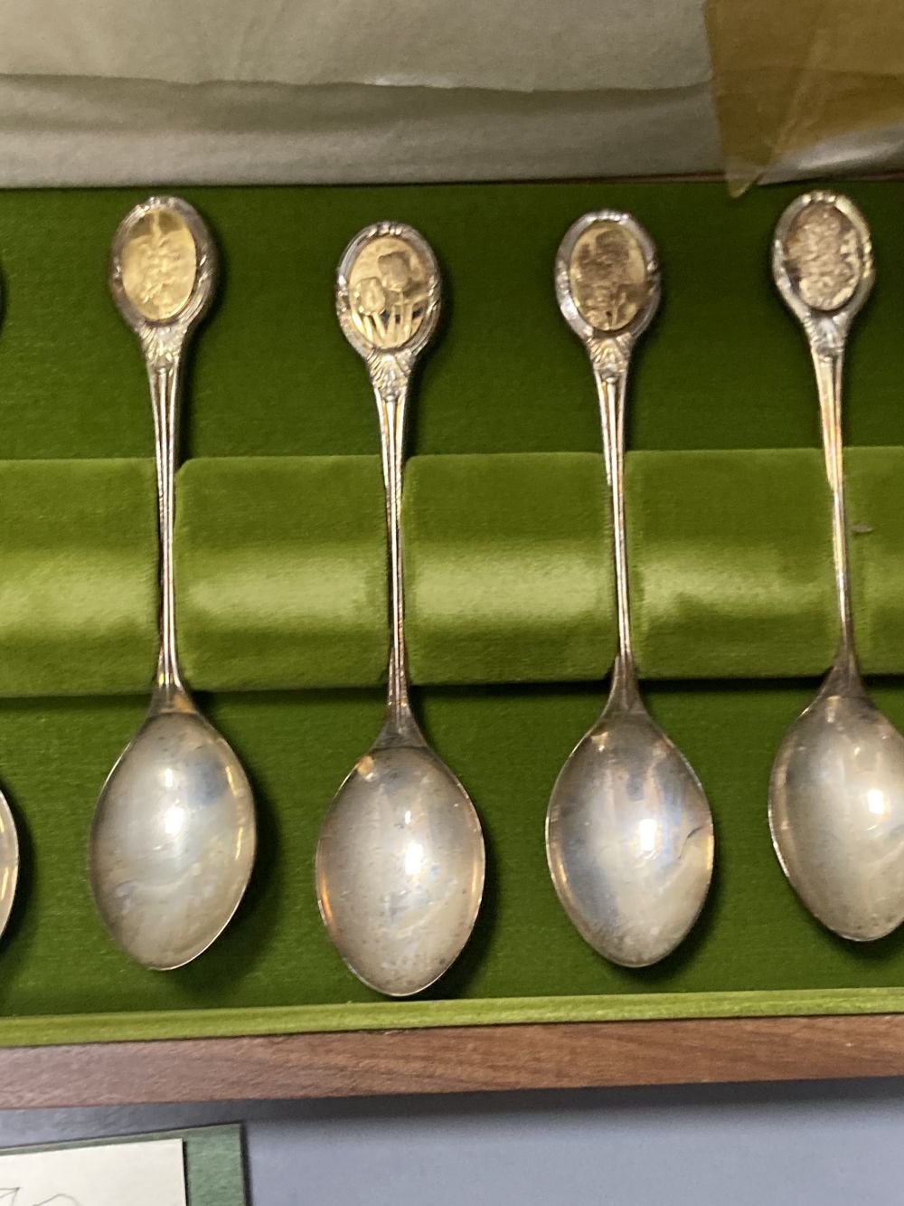 A modern cased set of twelve parcel gilt silver Royal Horticultural Society Flower Spoons by John Pinches,